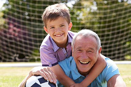 Grandfather can better hear grandchild thanks to hearing help